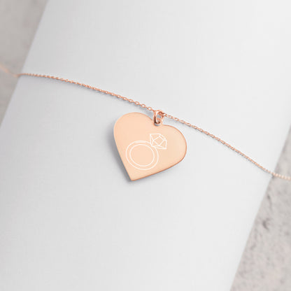 This engraved chain necklace with a sterling silver heart-shaped pendant makes for a perfect accessory for anyone in love with minimalistic and sophisticated jewelryEngraved Silver Heart Necklace