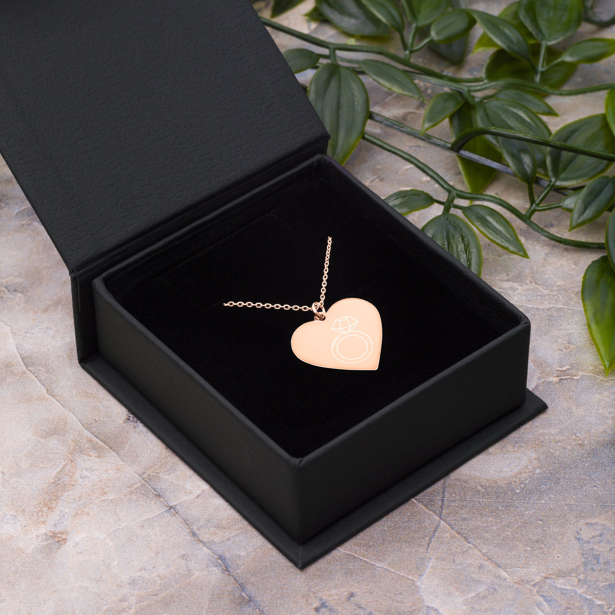 This engraved chain necklace with a sterling silver heart-shaped pendant makes for a perfect accessory for anyone in love with minimalistic and sophisticated jewelryEngraved Silver Heart Necklace