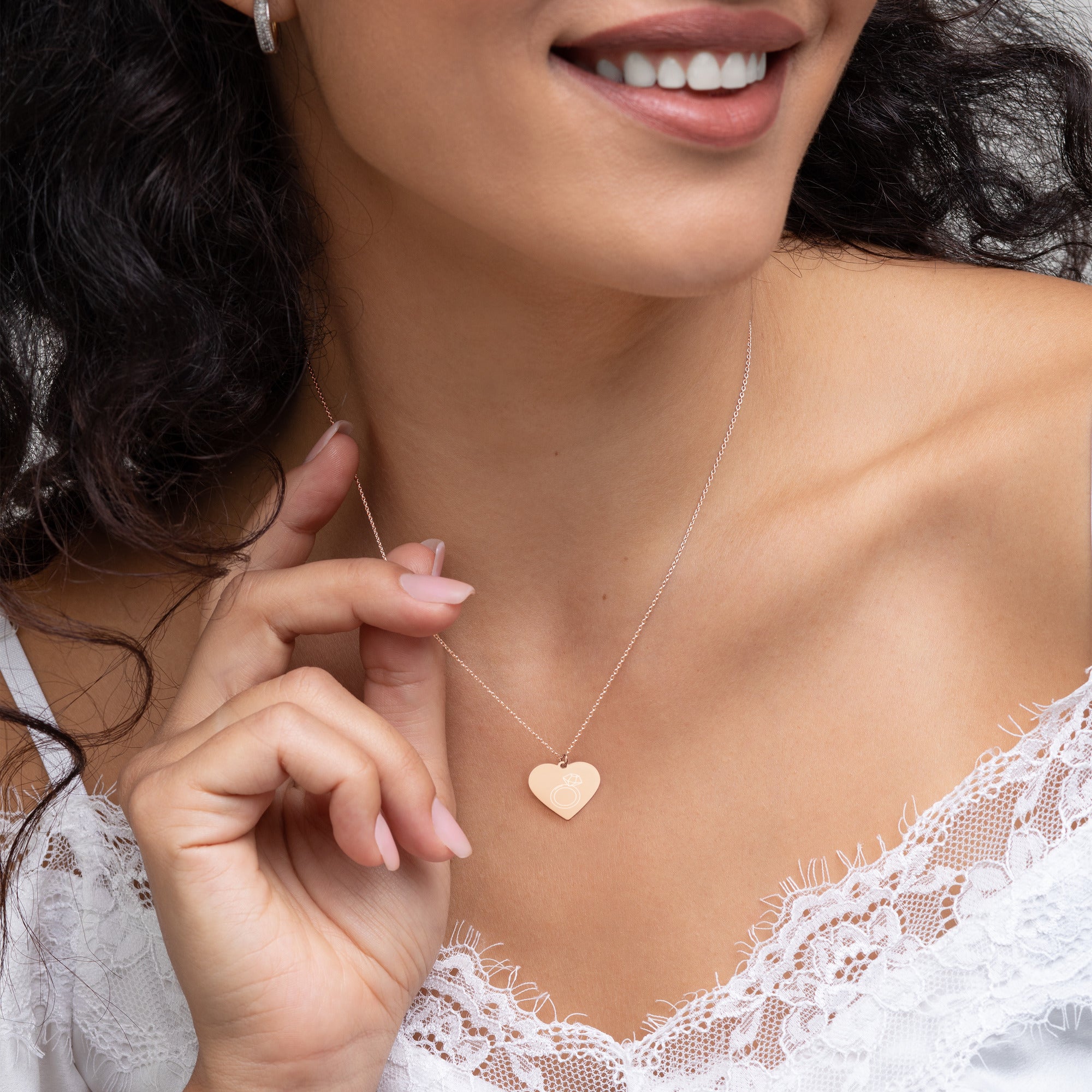 This engraved chain necklace with a sterling silver heart-shaped pendant makes for a perfect accessory for anyone in love with minimalistic and sophisticated jewelryEngraved Silver Heart Necklace