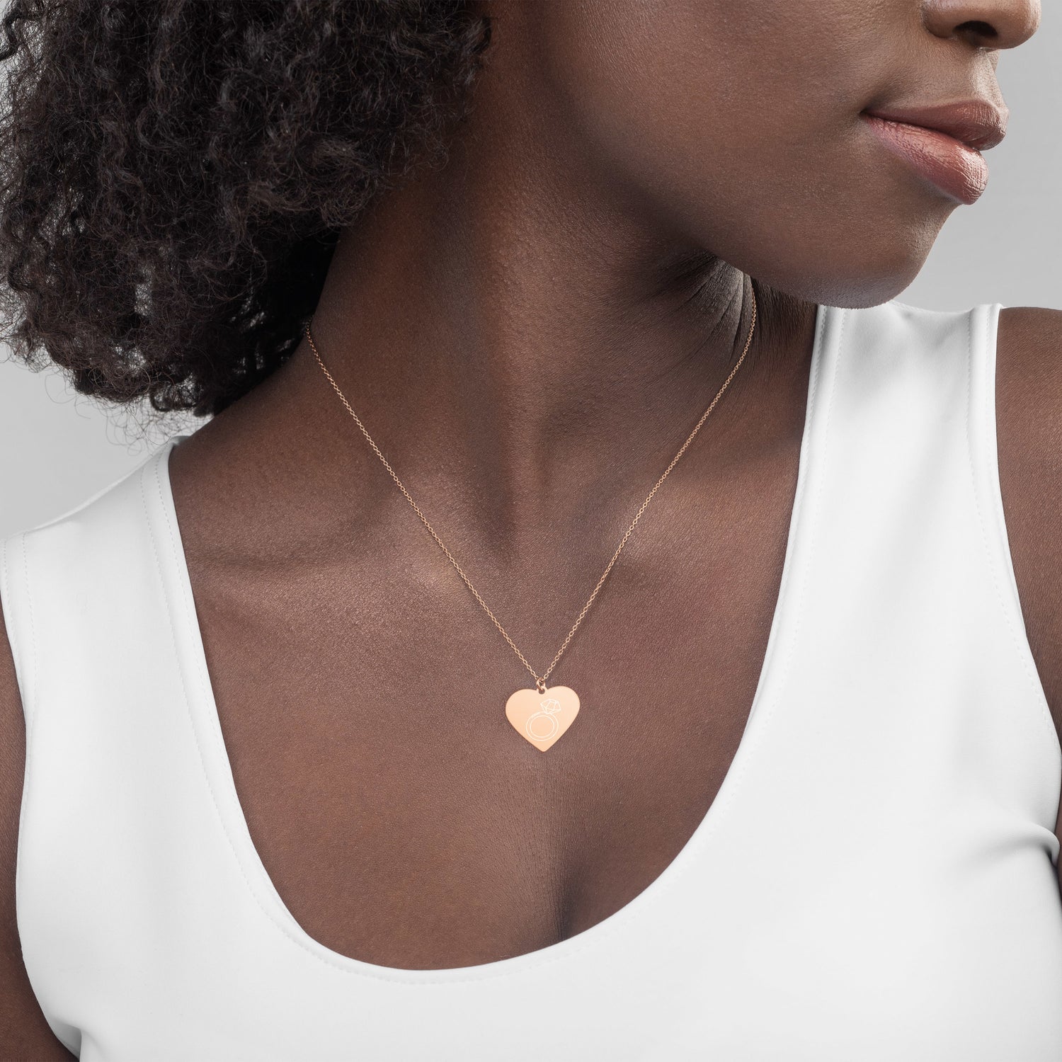 This engraved chain necklace with a sterling silver heart-shaped pendant makes for a perfect accessory for anyone in love with minimalistic and sophisticated jewelryEngraved Silver Heart Necklace