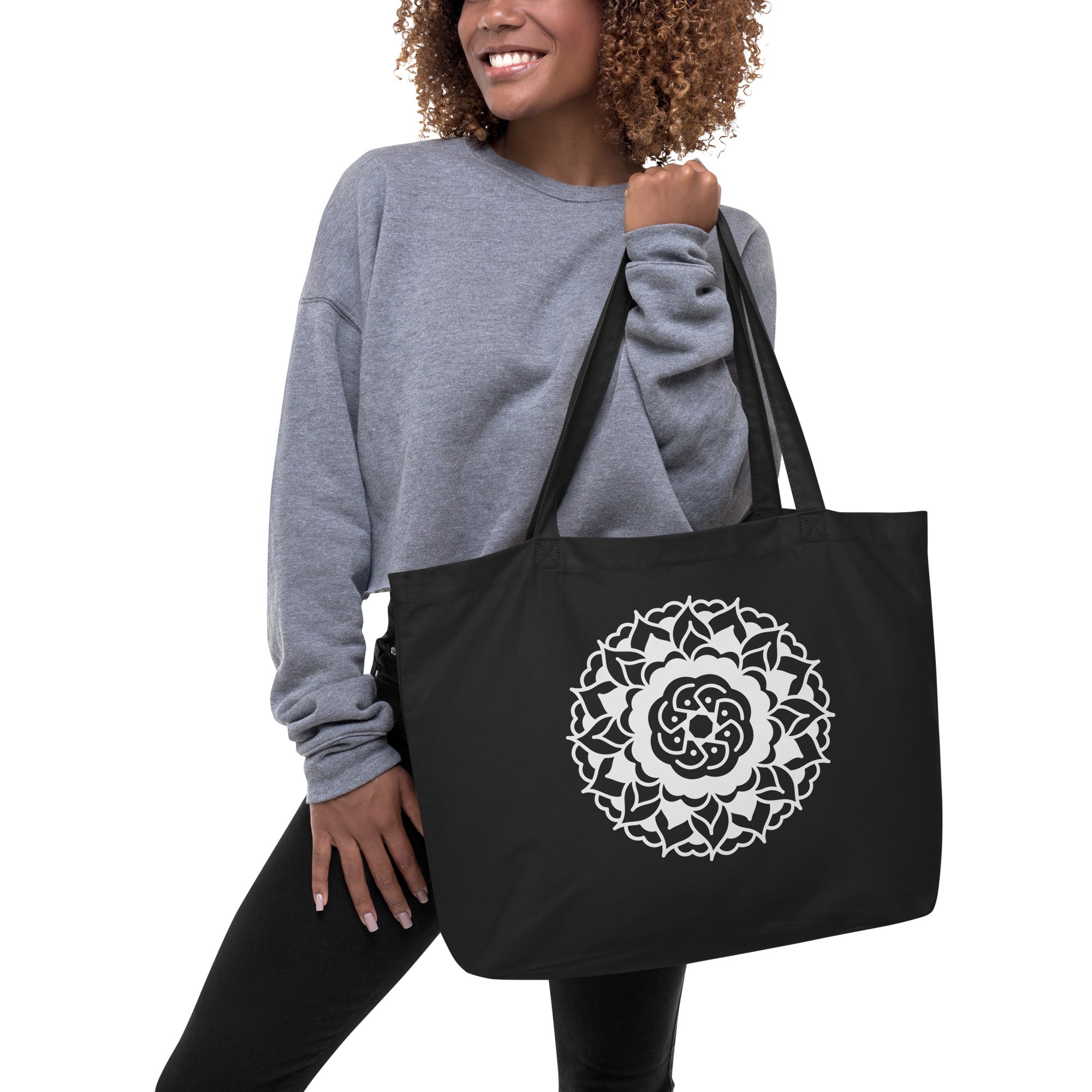 Get rid of all the plastic and pack your goodies in this spacious organic cotton tote bag. Fill it up with groceries, books, and travel essentials—there’s room for eMandala Large organic tote bag